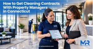 Cleaning company manager reviewing contracts with a Connecticut property manager